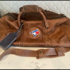 ROOTS leather duffel bag